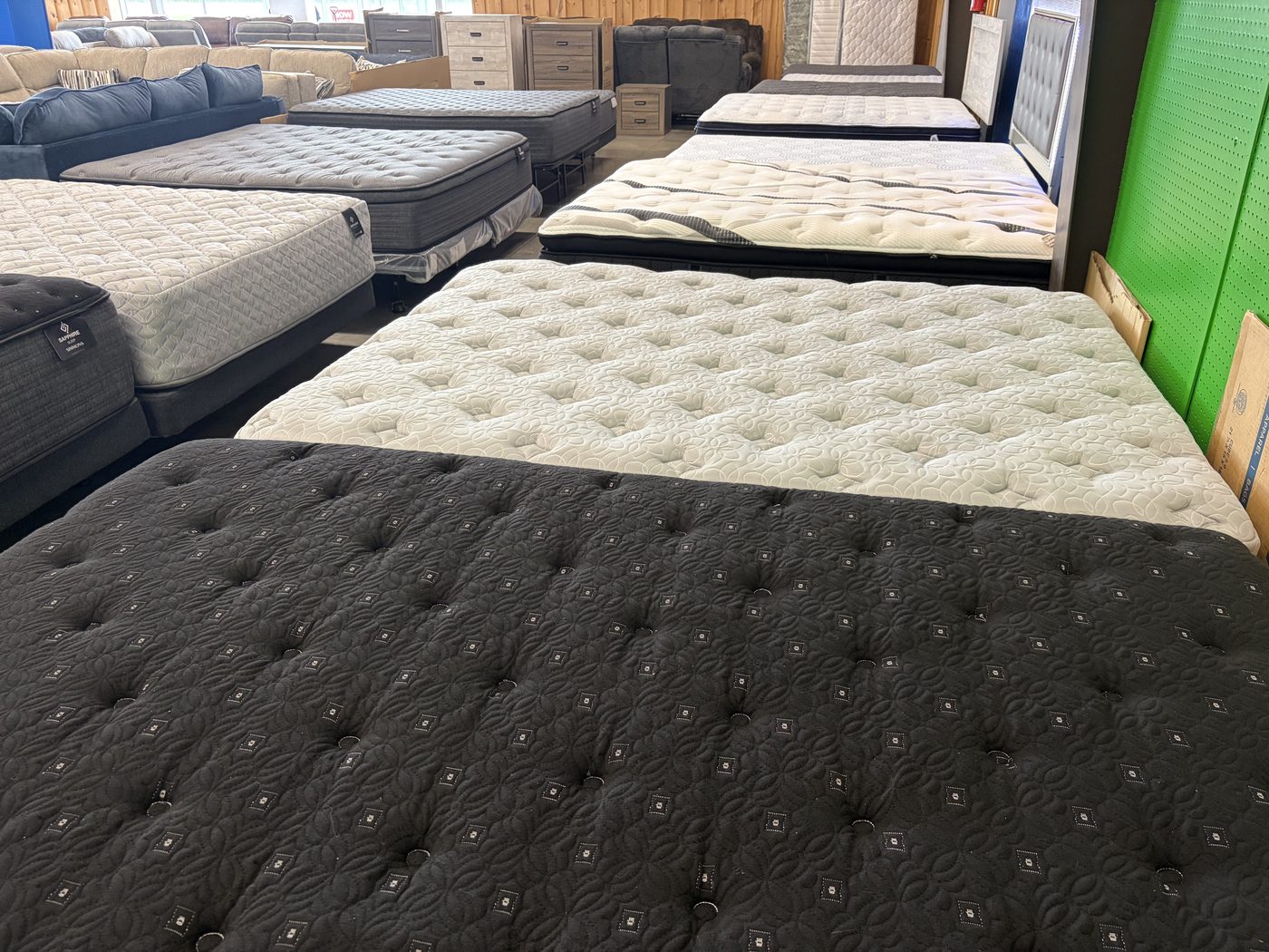 Mattresses on display, including Sapphire Sleep by Simmons