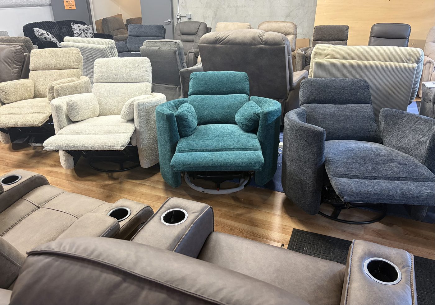 Swivel recliners in cream, teal and charcoal
